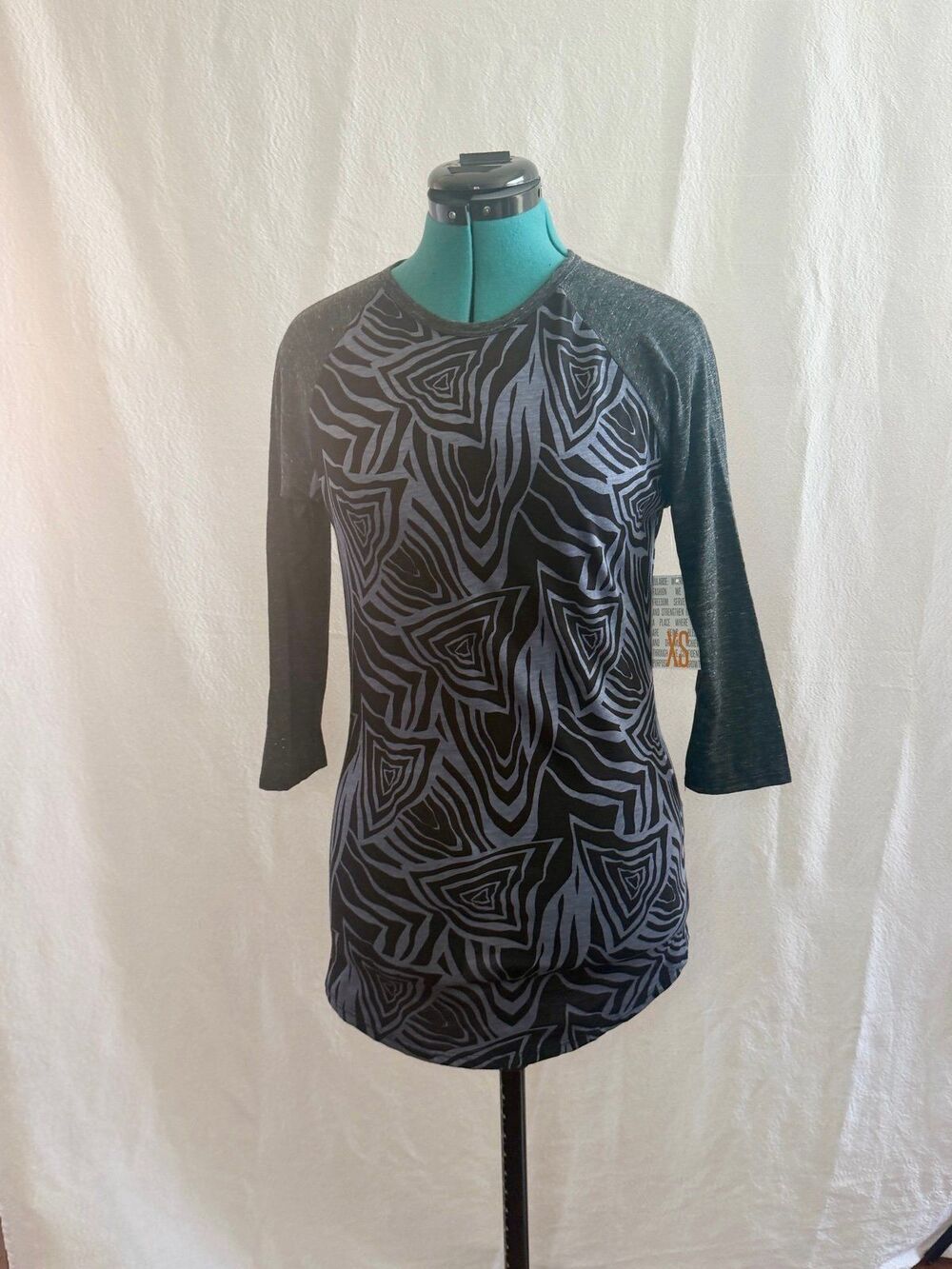NWT Lularoe Randy top size XS. Brand new with tags. Size XS.